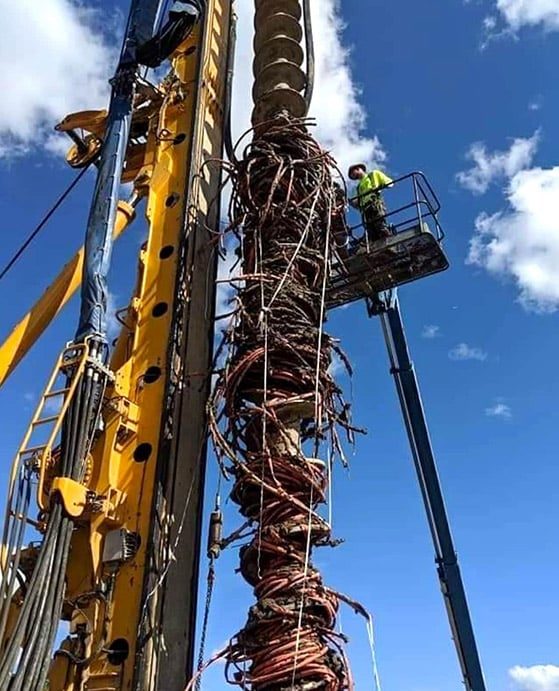 Man at the Top of Drilling Machine — Providing Excavation & Drain Services in Sunshine Coast, QLD